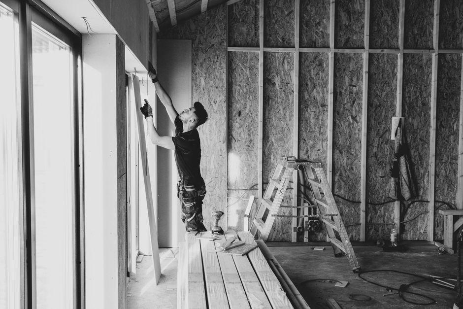 Contractor carefully installing a new home window